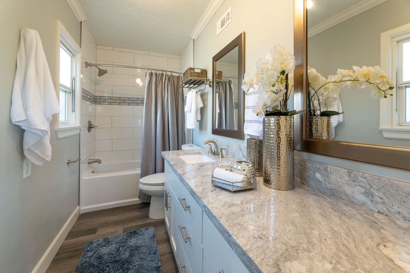 Bathroom after full gut remodel with subway tile and granite vanity