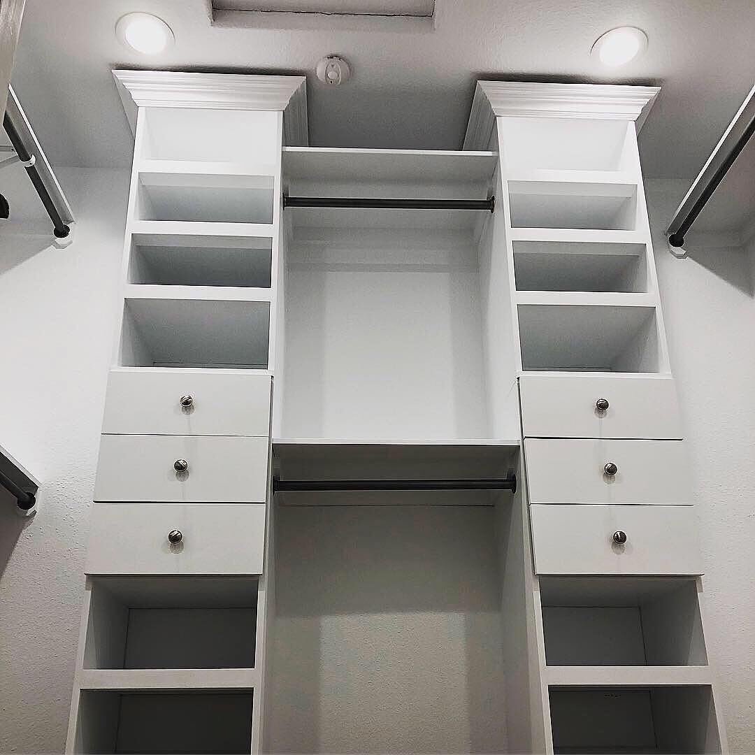 Custom white closet system with drawers and shelving after install
