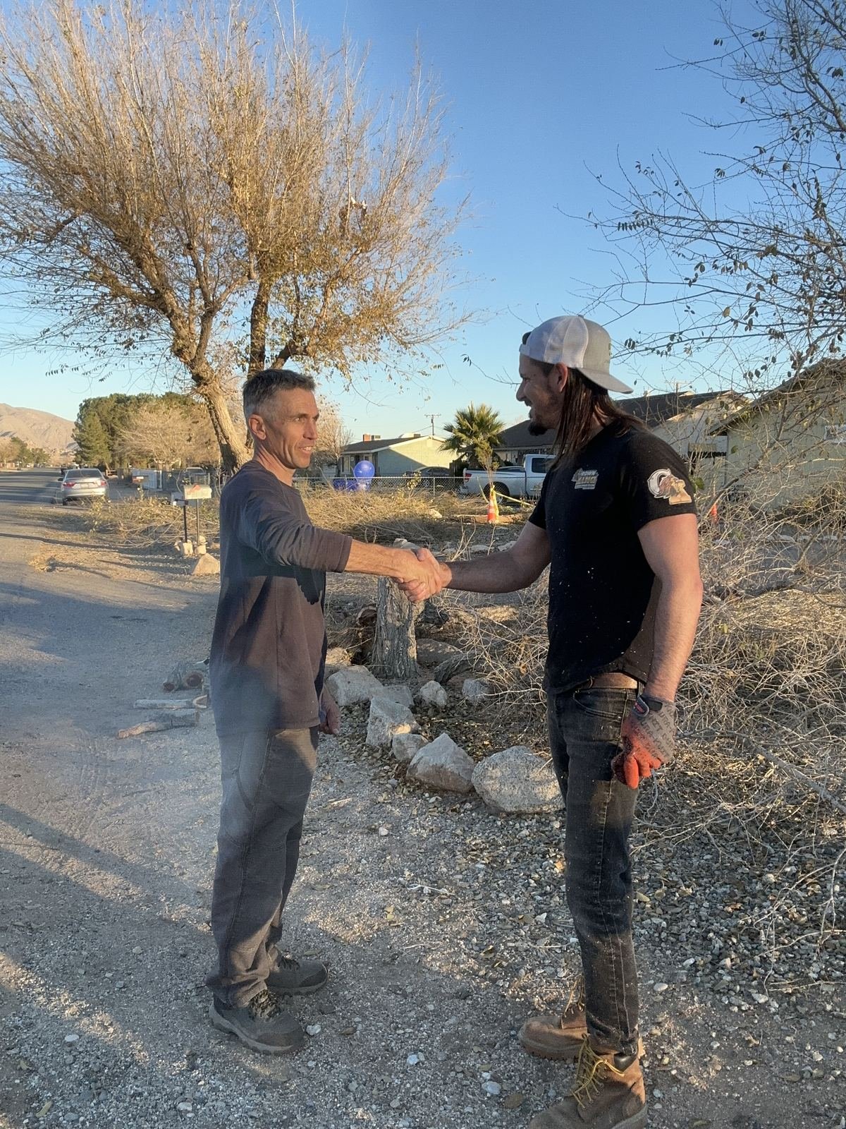 Rob shaking hands with a client in the High Desert