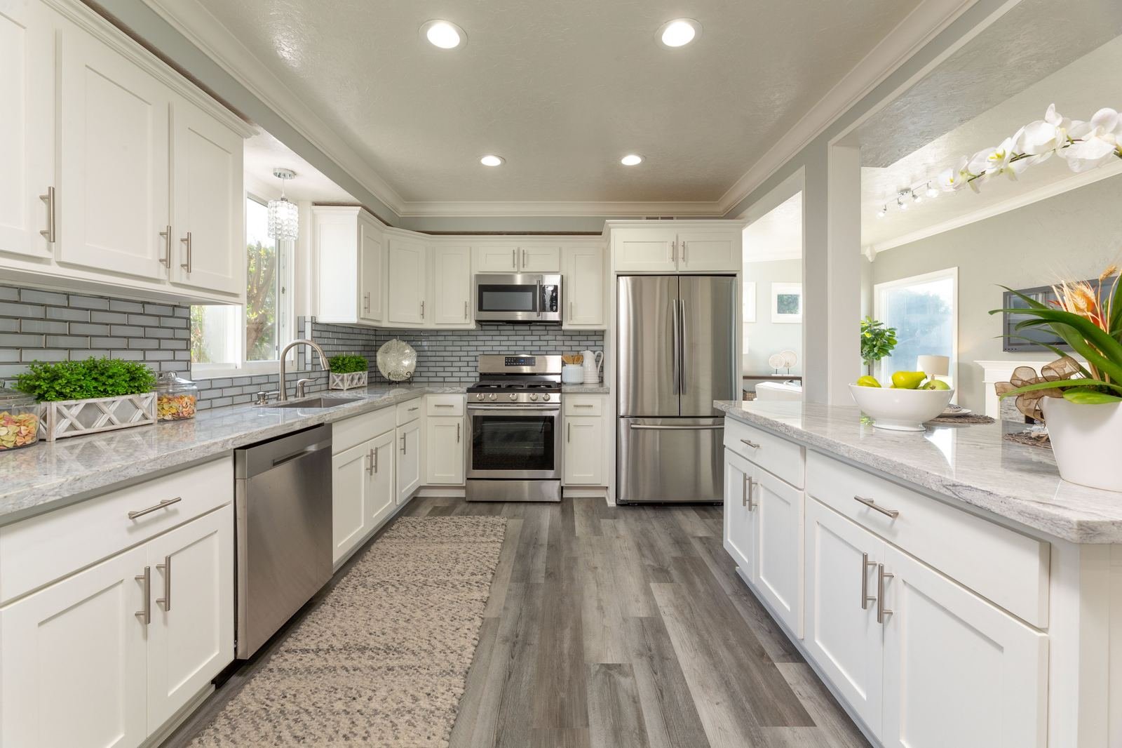 McConnell Ave kitchen after remodel, white cabinets and granite island